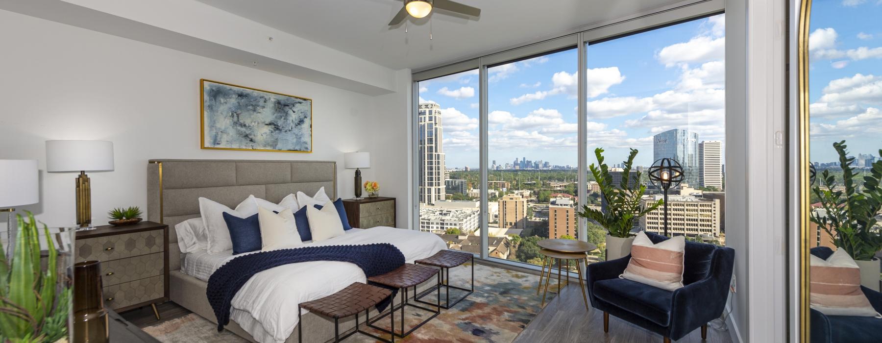 a bedroom with a large window